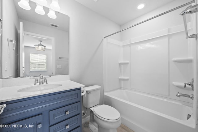 full bathroom featuring washtub / shower combination, vanity, and toilet