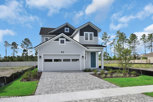 374 Sutton Dr, Ponte Vedra, FL 32081 - traditional home with decorative driveway, a garage, and board and batten siding