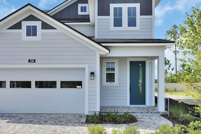 374 Sutton Dr, Ponte Vedra, FL 32081 - view of front of home featuring board and batten siding, driveway, and a porch