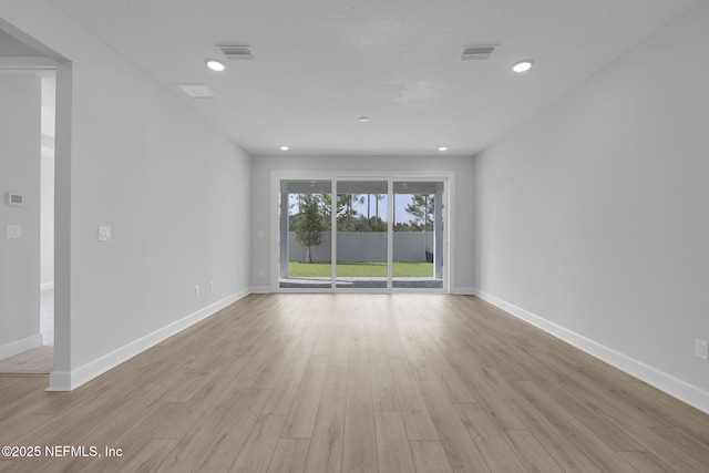 374 Sutton Dr, Ponte Vedra, FL 32081 - spare room with light wood finished floors, recessed lighting, and a textured ceiling