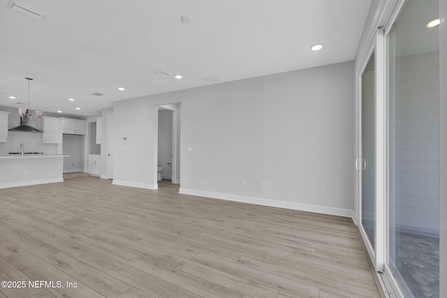 374 Sutton Dr, Ponte Vedra, FL 32081 - unfurnished living room featuring light wood finished floors and recessed lighting