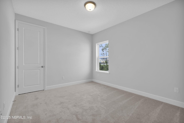 374 Sutton Dr, Ponte Vedra, FL 32081 - spare room featuring carpet flooring and a textured ceiling