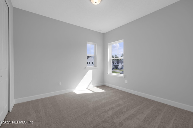 374 Sutton Dr, Ponte Vedra, FL 32081 - carpeted empty room with baseboards