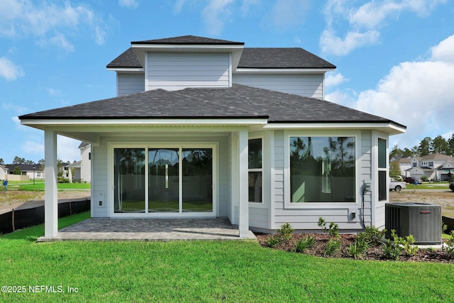 374 Sutton Dr, Ponte Vedra, FL 32081 - rear view of property with a yard, a shingled roof, and a patio