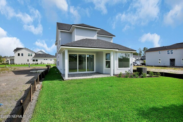 374 Sutton Dr, Ponte Vedra, FL 32081 - back of house with a lawn, a shingled roof, and a patio area