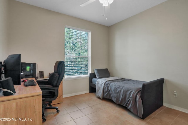 tiled bedroom featuring multiple windows and ceiling fan