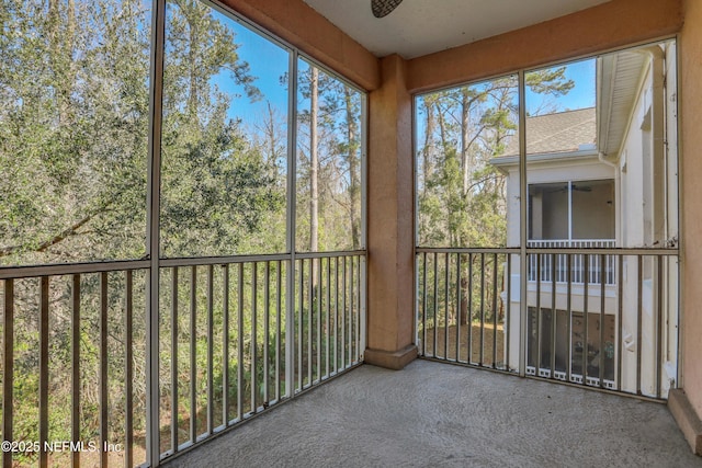 unfurnished sunroom with plenty of natural light