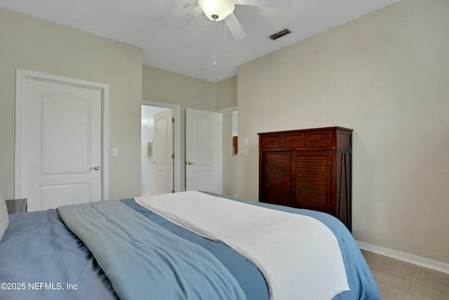 bedroom featuring light tile patterned floors and ceiling fan