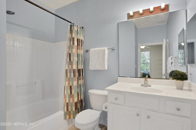 full bathroom featuring shower / tub combo with curtain, vanity, and toilet