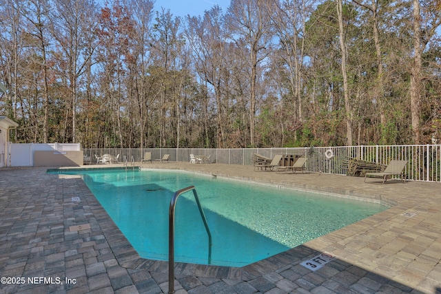 view of swimming pool featuring a patio