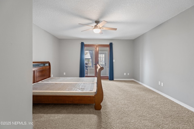 bedroom with carpet flooring, a textured ceiling, and ceiling fan