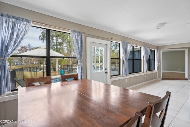 dining space with light tile patterned floors