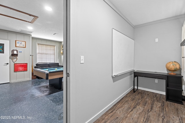 hallway with a textured ceiling and dark wood-type flooring