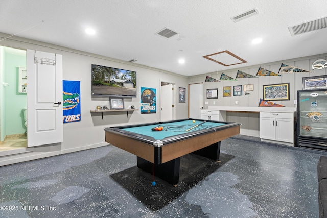 game room featuring a textured ceiling and billiards