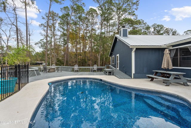 view of swimming pool with a patio area and central AC unit