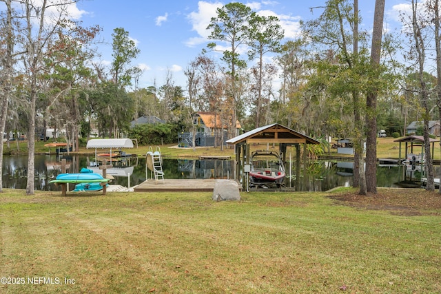 view of dock featuring a lawn and a water view