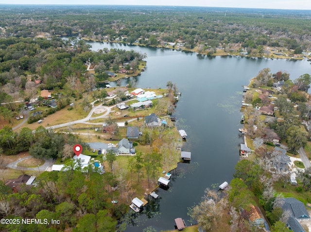 birds eye view of property with a water view