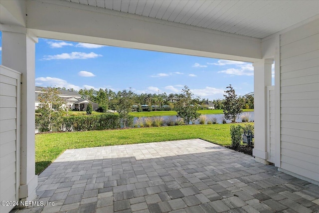 view of patio featuring a water view