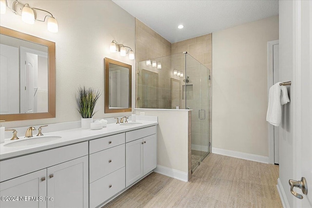 bathroom with vanity and an enclosed shower