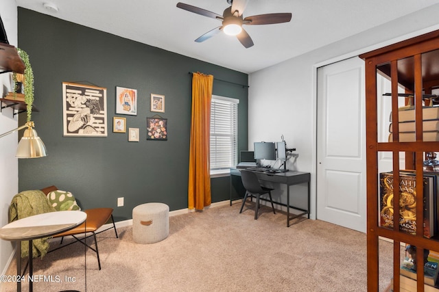 home office with light carpet and ceiling fan