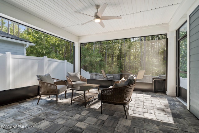 sunroom / solarium with ceiling fan