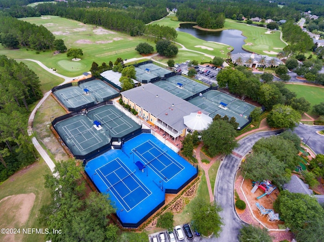 birds eye view of property with a water view