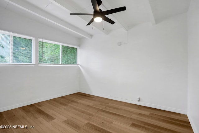 unfurnished room with vaulted ceiling with beams, ceiling fan, and light wood-type flooring