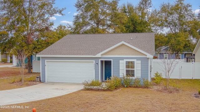 view of front facade featuring a garage and a front lawn