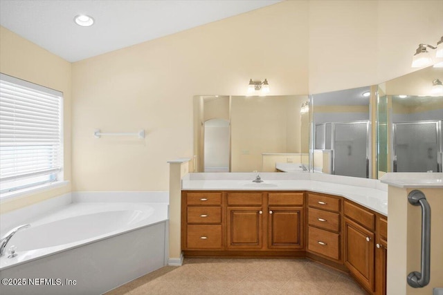 bathroom with separate shower and tub, tile patterned flooring, and vanity