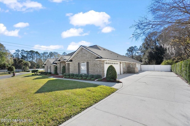 view of front of home featuring a front lawn and a garage