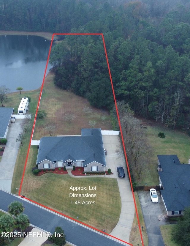 birds eye view of property with a water view