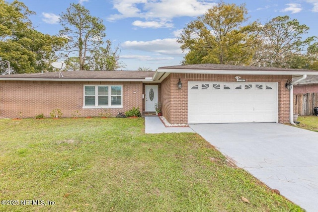 ranch-style home with a garage and a front lawn