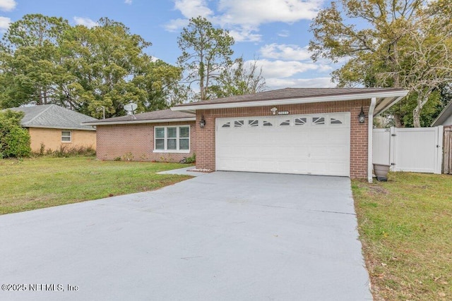 ranch-style house featuring a garage and a front lawn