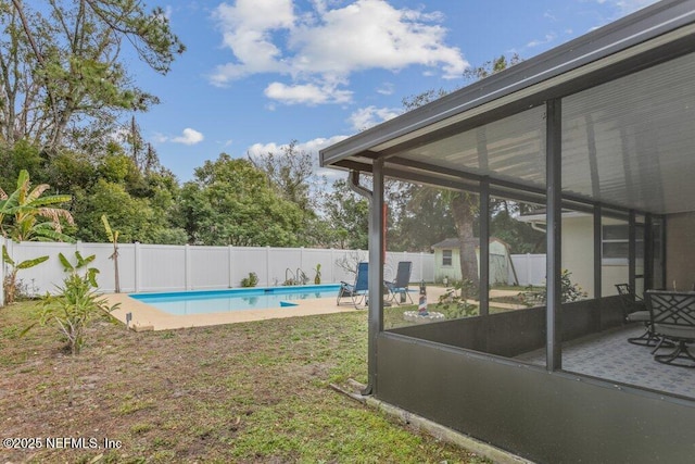 view of yard featuring a fenced in pool and a patio