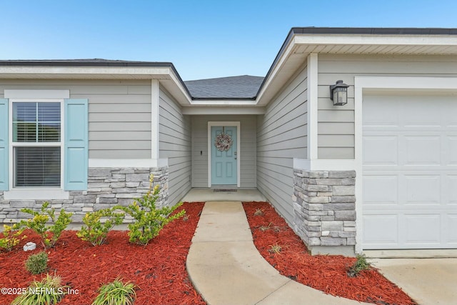 entrance to property with a garage