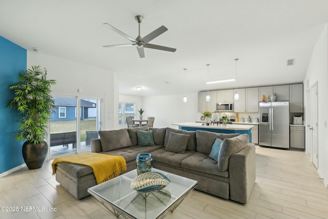 living room with ceiling fan