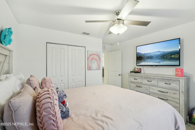 bedroom featuring ceiling fan and a closet