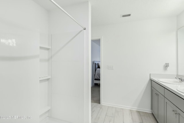 bathroom featuring hardwood / wood-style floors and vanity