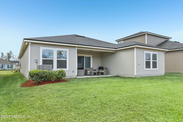 back of property with cooling unit, a patio, and a yard