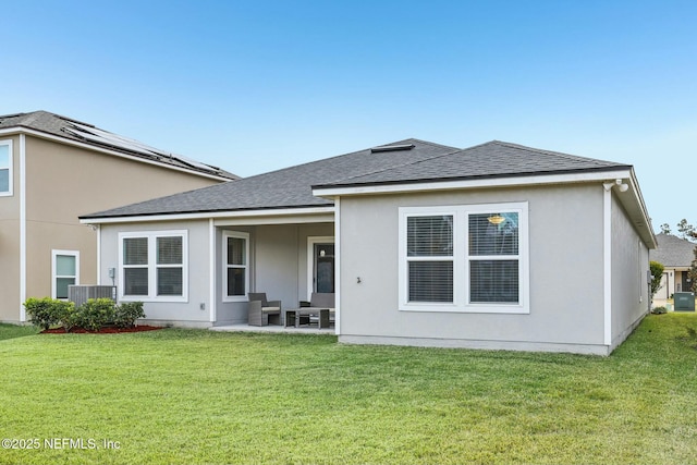 back of property featuring a lawn and a patio area