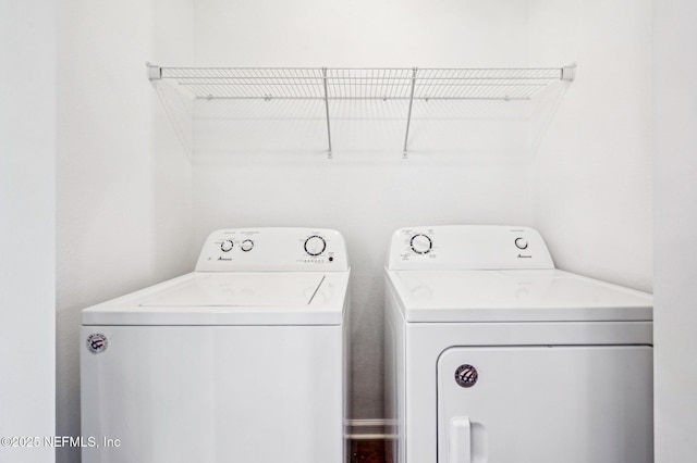 clothes washing area featuring washing machine and clothes dryer