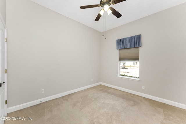 unfurnished room with ceiling fan and carpet floors