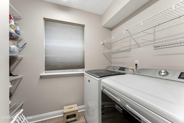 laundry room with washing machine and dryer