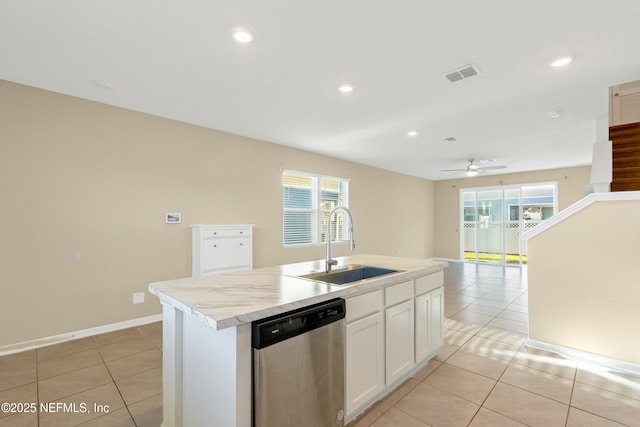 kitchen featuring white cabinets, a center island with sink, sink, stainless steel dishwasher, and ceiling fan