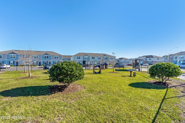 view of property's community with a yard