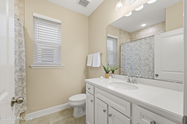 bathroom featuring tile patterned floors, toilet, and vanity