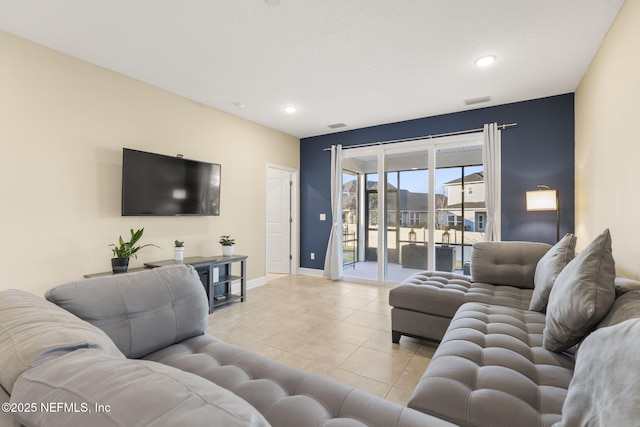 living room with light tile patterned flooring