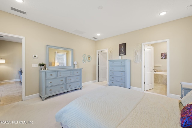 carpeted bedroom with connected bathroom