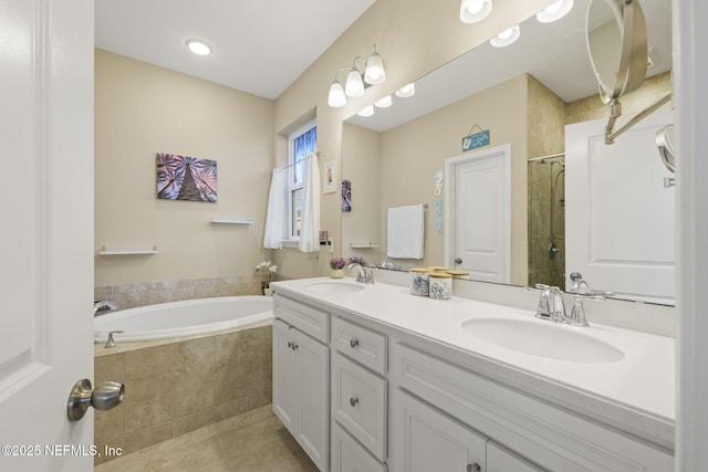 bathroom with vanity, tile patterned floors, and shower with separate bathtub