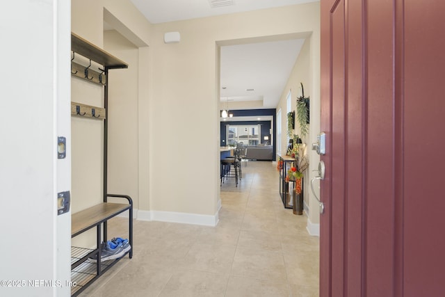 hallway with light tile patterned flooring